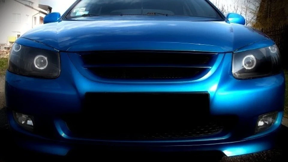 KIA Cerato blue and some black 2