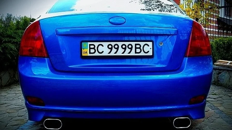 KIA Cerato blue and some black 3