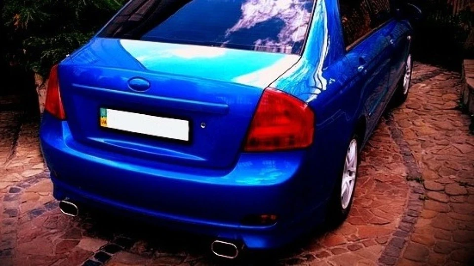 KIA Cerato blue and some black 4