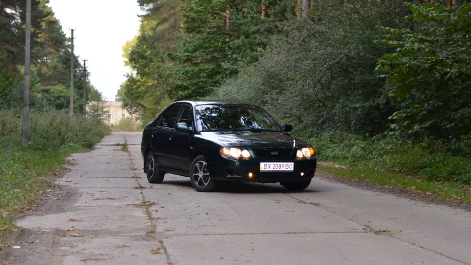 KIA Shuma Зелена пляшка