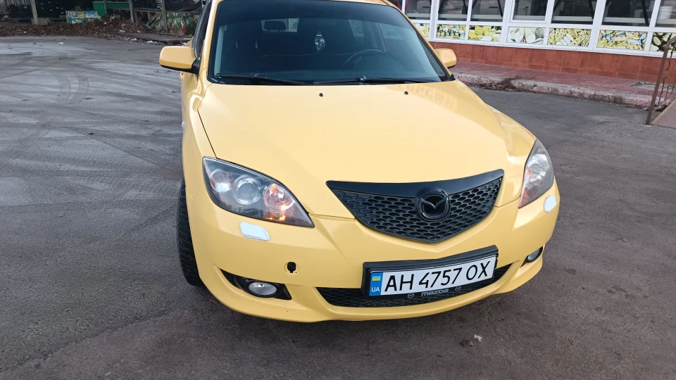 Mazda 3 Жовта улитка