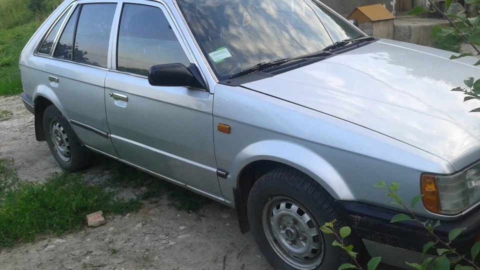 Mazda 323 )))) 3
