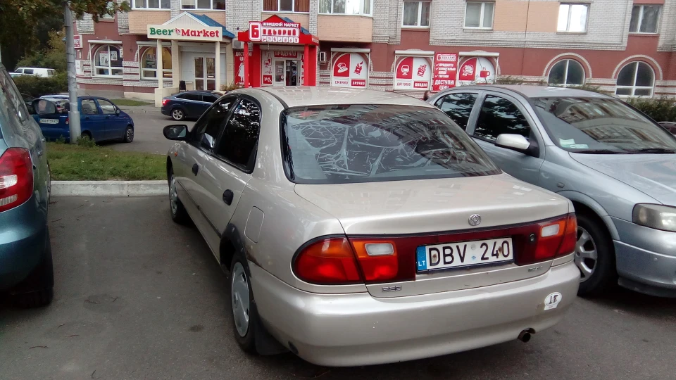 Mazda 323 На бляхах