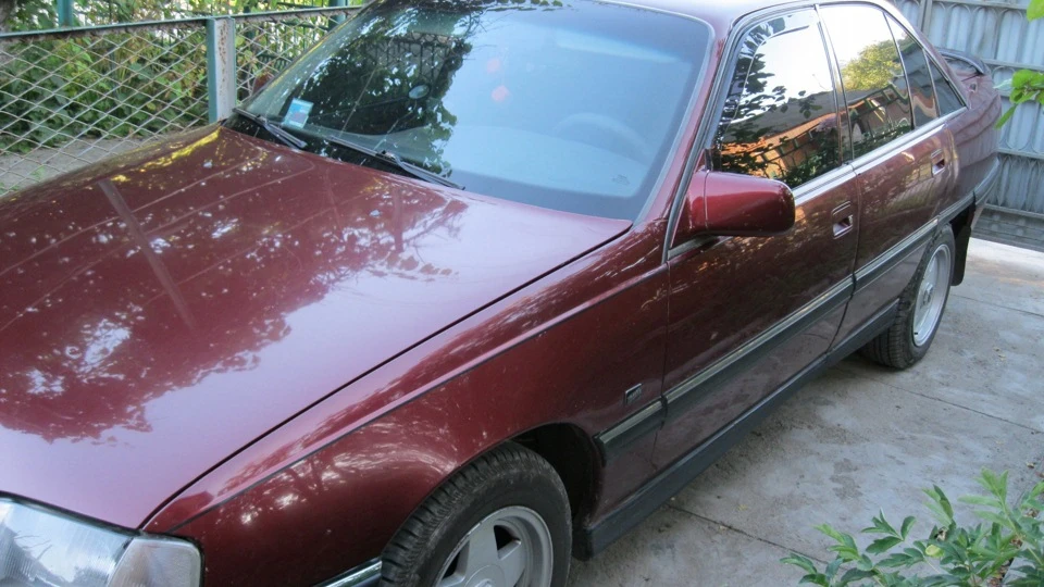 Opel Omega вишневий металік 2.0і 4