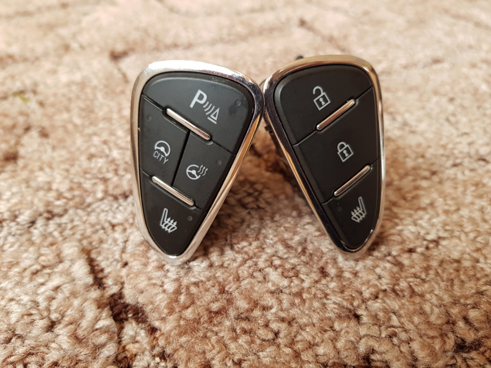 Кнопки підігріву сидінь та блокування дверей від Opel Corsa E 3