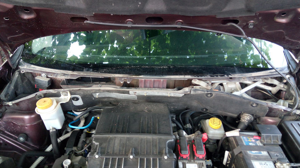 Cleaning windshield water tray 2