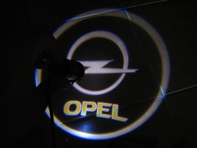 Продам додаткове підсвічування у двері у формі логотипу OPEL 1