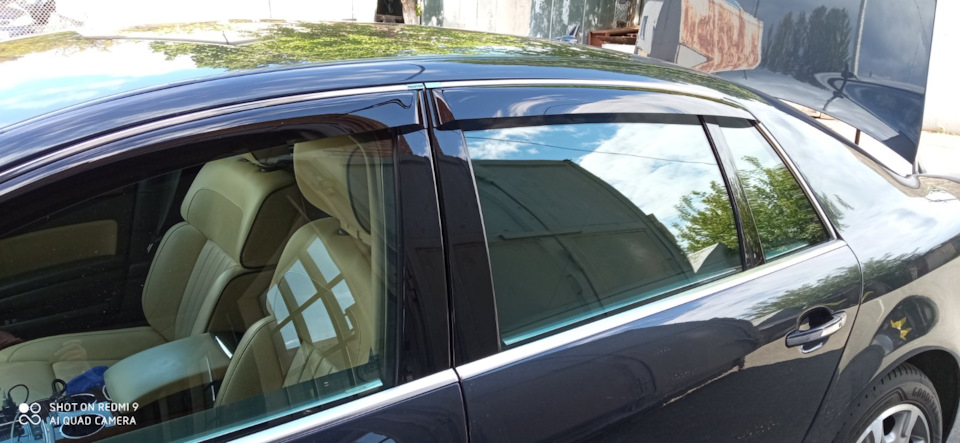 Тонування задніх бічних вікон VW Phaeton шторками Laitovo 4